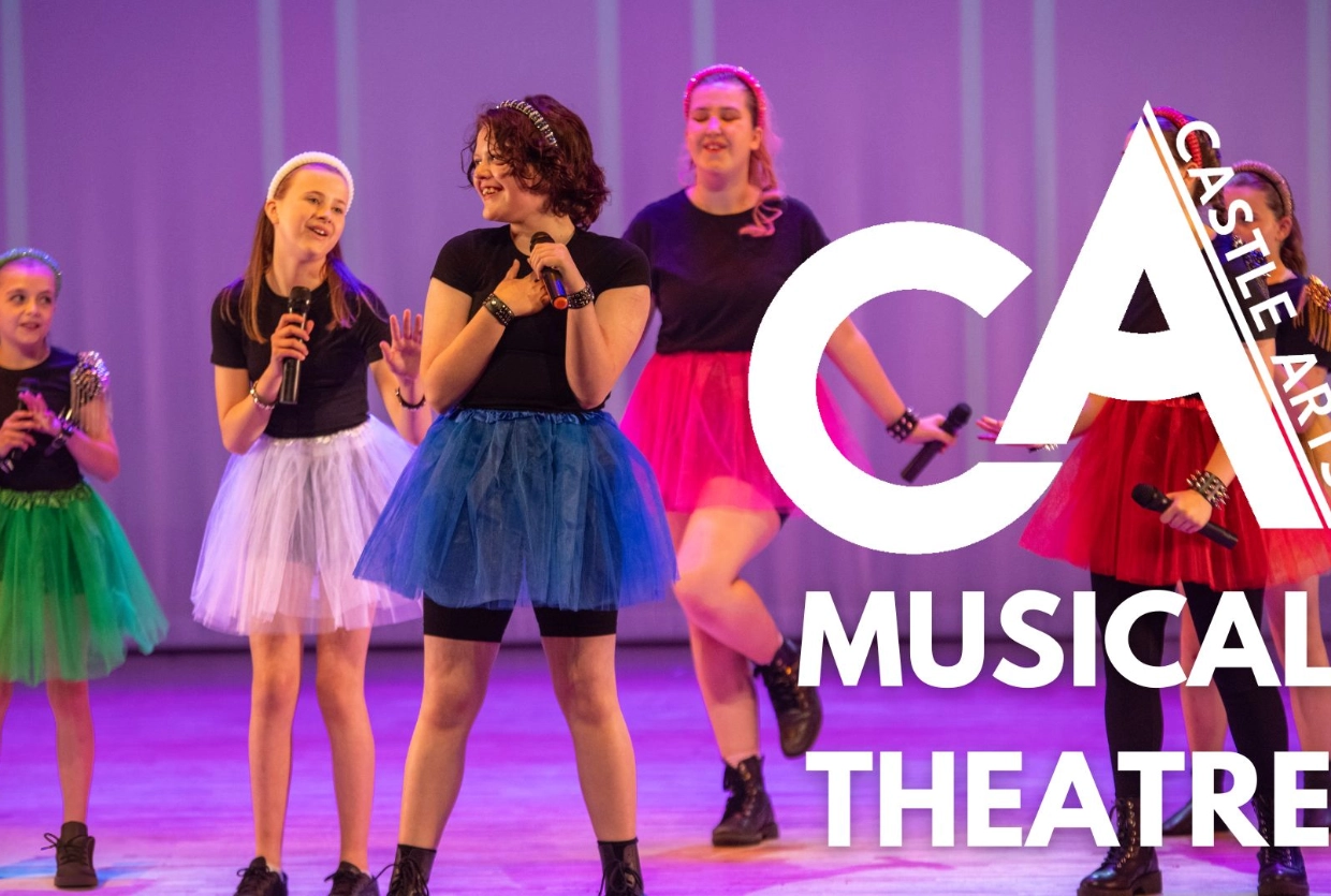 girls in colourful tutus singing
