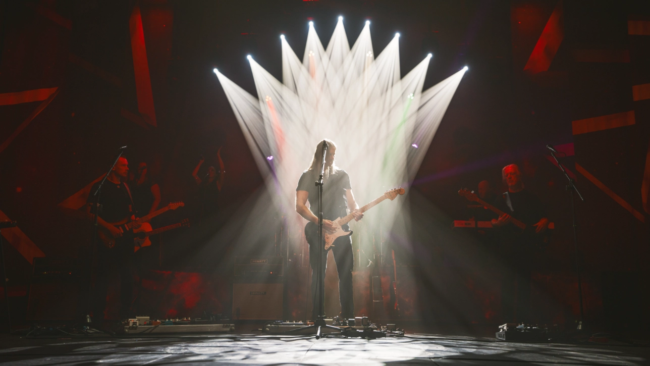 Band performing with lightshow