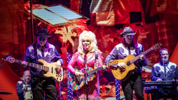 Sarah Jayne as Dolly with band on stage