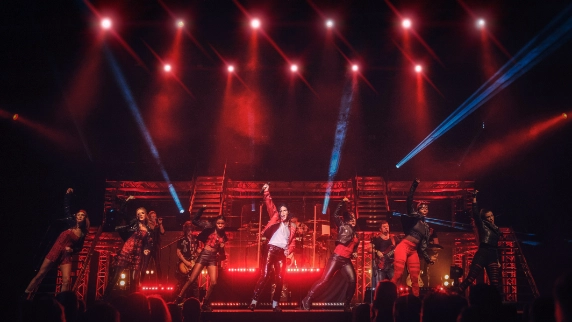 Ben Bowden and dancers on stage